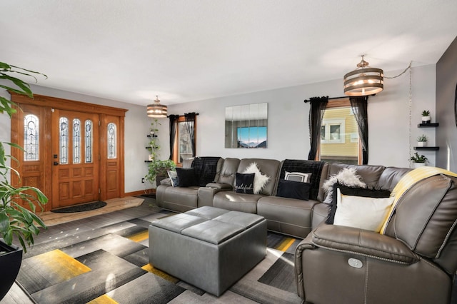 living room featuring baseboards and wood finished floors