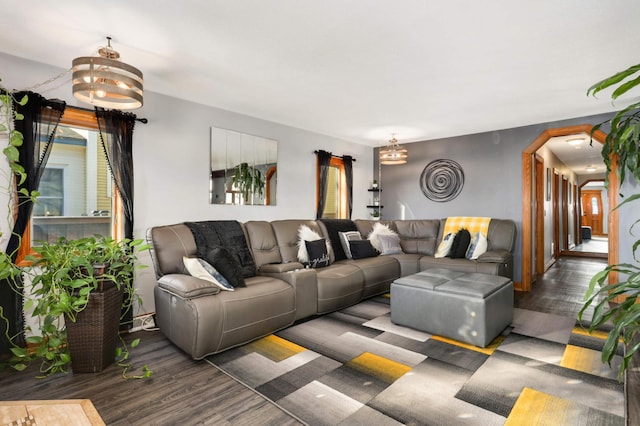 living room featuring an inviting chandelier and wood finished floors