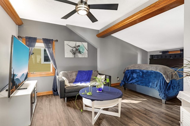 bedroom with baseboards, wood finished floors, and vaulted ceiling with beams