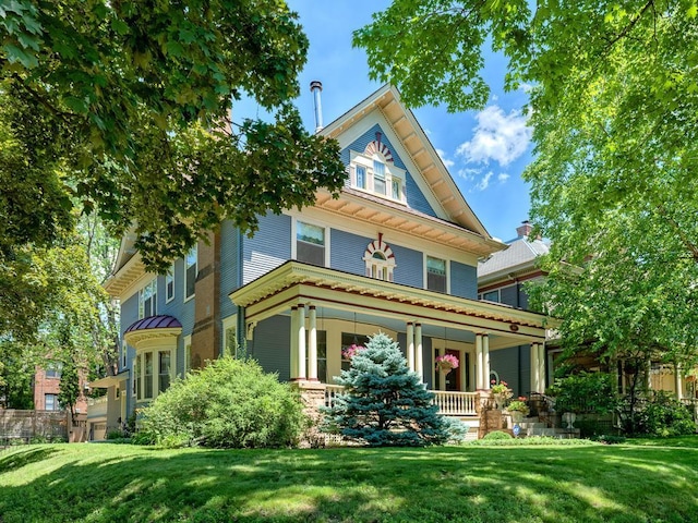 857 Fairmount Ave, Saint Paul, MN 55105 - victorian-style house with a porch and a front lawn