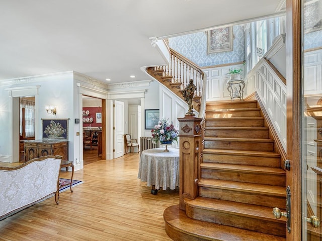 857 Fairmount Ave, Saint Paul, MN 55105 - stairway featuring wood finished floors, crown molding, and recessed lighting