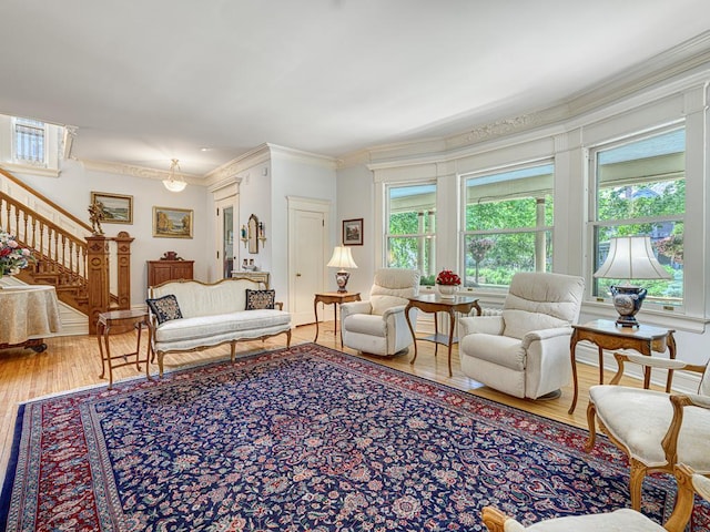 857 Fairmount Ave, Saint Paul, MN 55105 - living room with wood finished floors, crown molding, and stairs