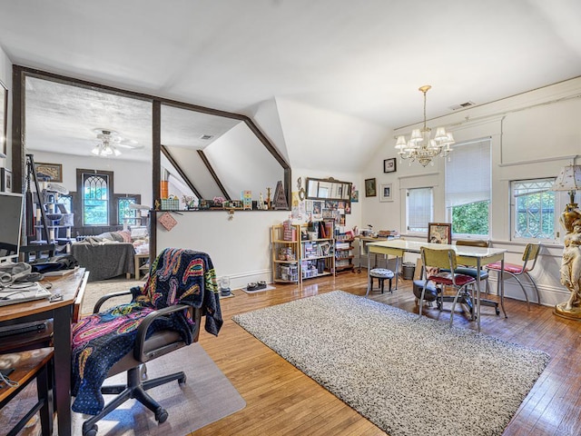 857 Fairmount Ave, Saint Paul, MN 55105 - home office with wood finished floors, a chandelier, a ceiling fan, and lofted ceiling