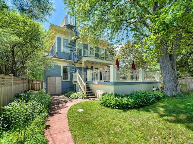 857 Fairmount Ave, Saint Paul, MN 55105 - rear view of house featuring stairs, a fenced backyard, and a balcony