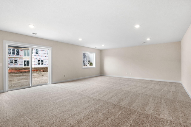 carpeted spare room with recessed lighting and baseboards