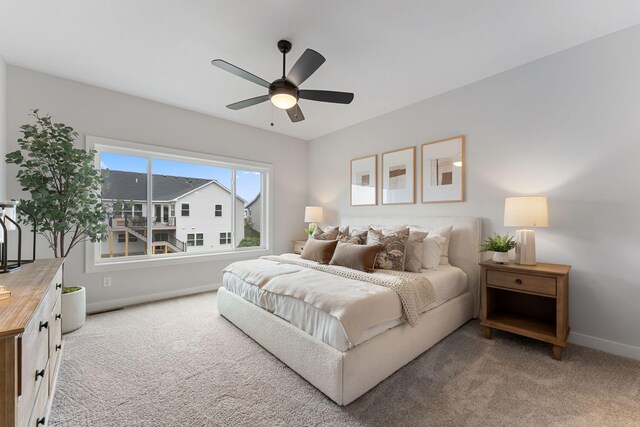 17771 Elkwood Ct, Lakeville, MN 55024 - bedroom with light colored carpet, baseboards, and a ceiling fan