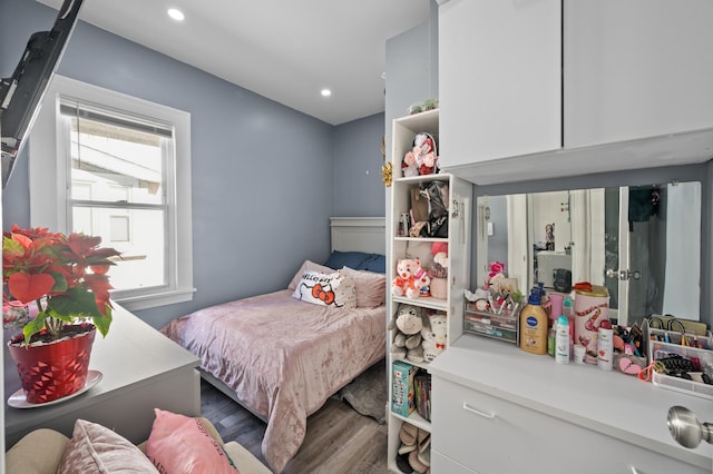 bedroom featuring wood finished floors and recessed lighting