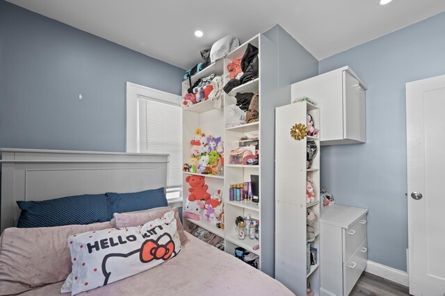 bedroom featuring recessed lighting, baseboards, and wood finished floors