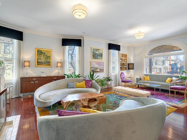 living room with crown molding, a healthy amount of sunlight, and wood-type flooring