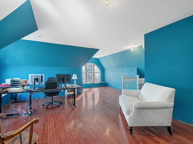 office space featuring lofted ceiling and hardwood / wood-style flooring