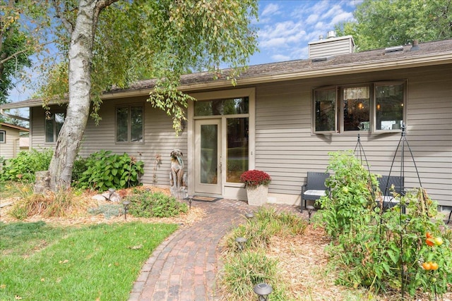 view of front of home featuring a chimney