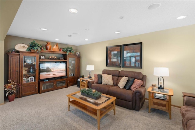 living room featuring light carpet, baseboards, and recessed lighting