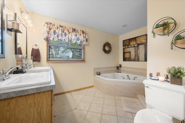 bathroom with toilet, a sink, a textured ceiling, a bath, and tile patterned floors