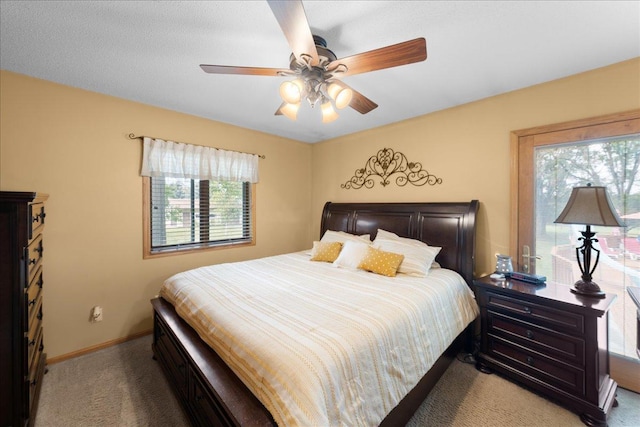 bedroom featuring carpet, baseboards, and a ceiling fan