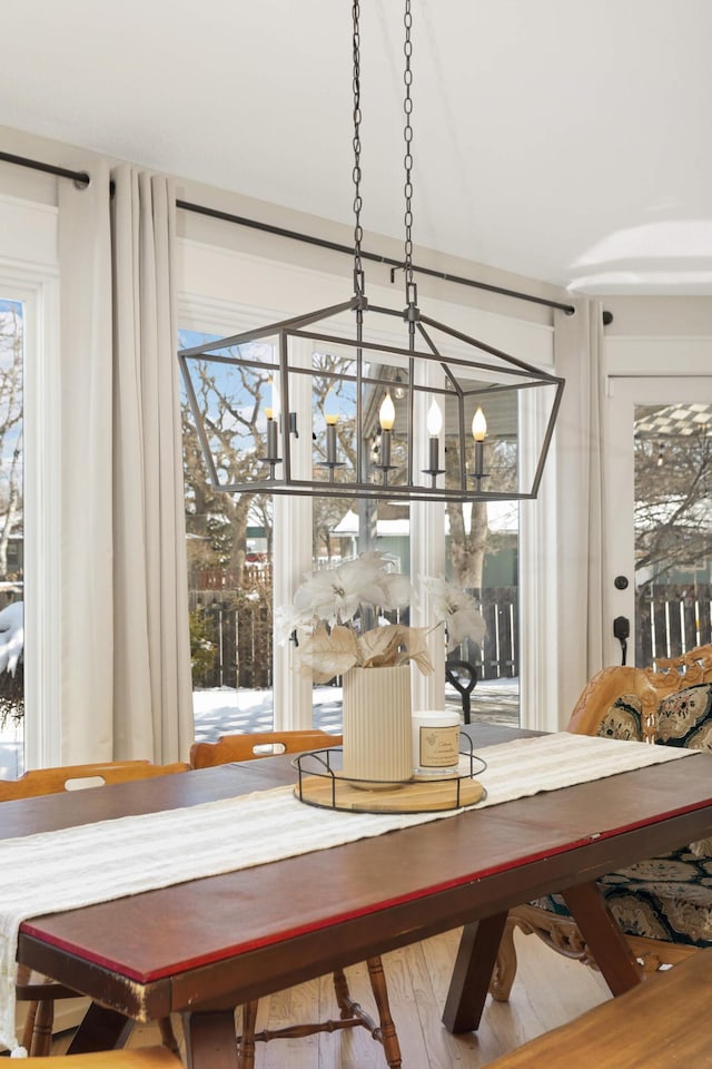 dining room with a chandelier and wood finished floors