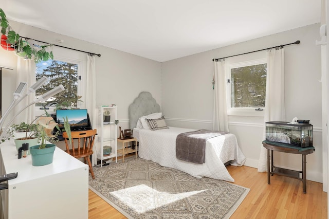 bedroom with light wood-style floors