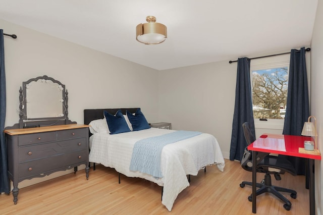 bedroom with light wood finished floors