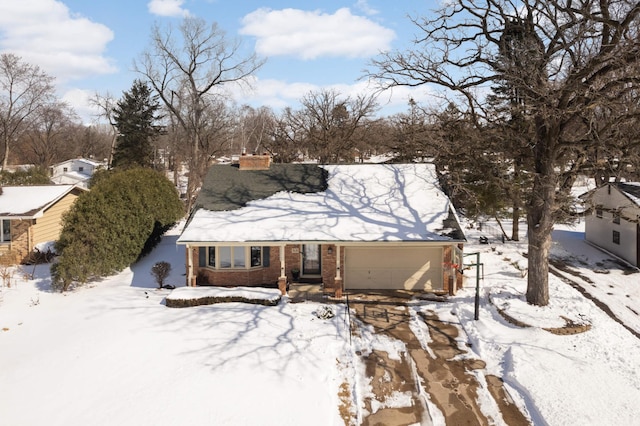 view of front of property featuring brick siding and a chimney