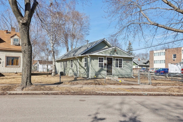 view of front of home with a gate, entry steps, and fence