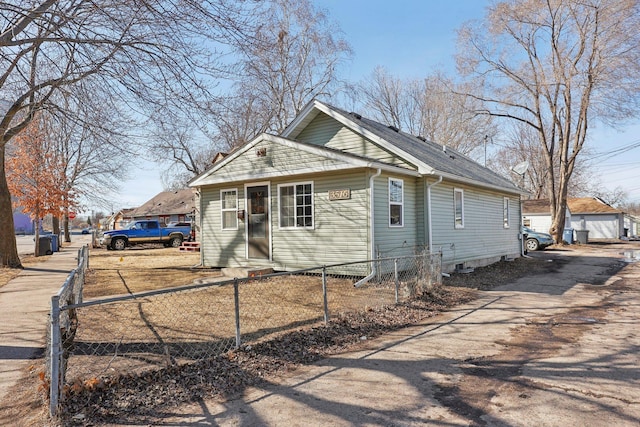 bungalow-style home featuring a fenced front yard