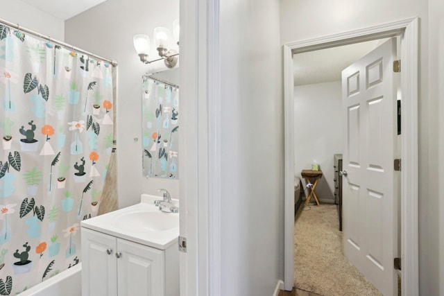 full bath featuring vanity and shower / bath combination with curtain