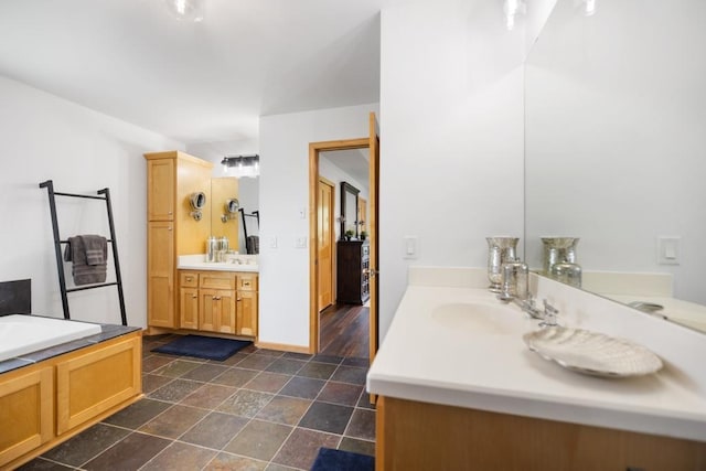 11050 Sweetwater Path, Woodbury, MN 55129 - full bathroom with two vanities and stone finish floors