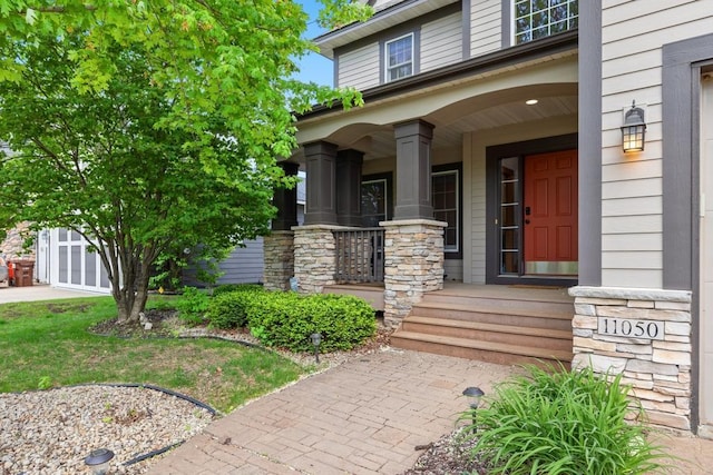 11050 Sweetwater Path, Woodbury, MN 55129 - doorway to property with a porch and stone siding
