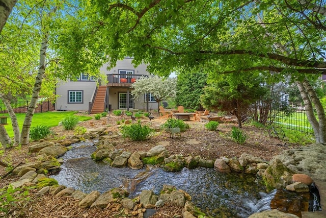11050 Sweetwater Path, Woodbury, MN 55129 - view of yard featuring a deck, stairs, and fence