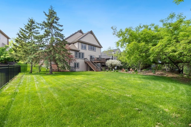 11050 Sweetwater Path, Woodbury, MN 55129 - view of yard featuring stairway and a wooden deck