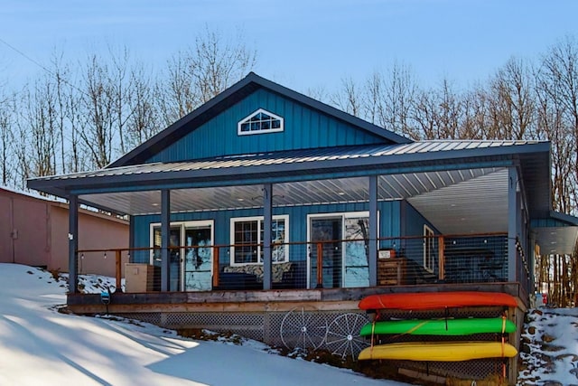 view of front of property with metal roof and a porch