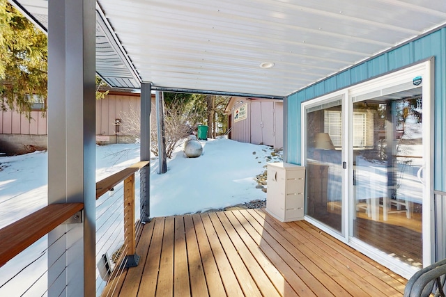 view of snow covered deck