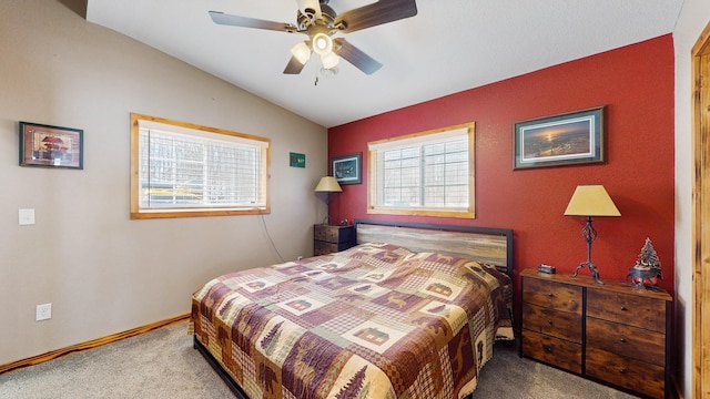 bedroom featuring vaulted ceiling, a ceiling fan, baseboards, and carpet floors