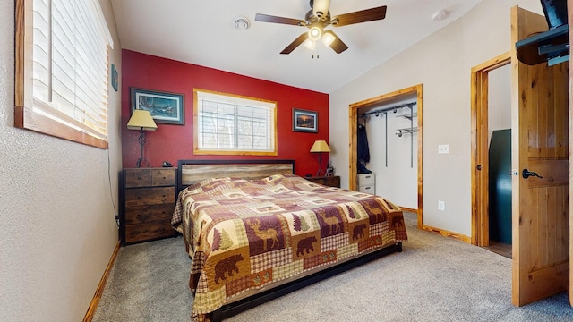 carpeted bedroom featuring ceiling fan, baseboards, and lofted ceiling