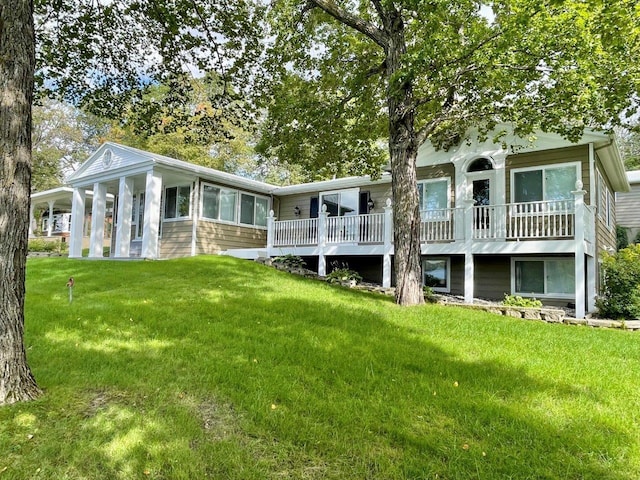 rear view of property with a lawn