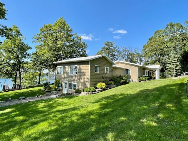 view of home's exterior with a lawn