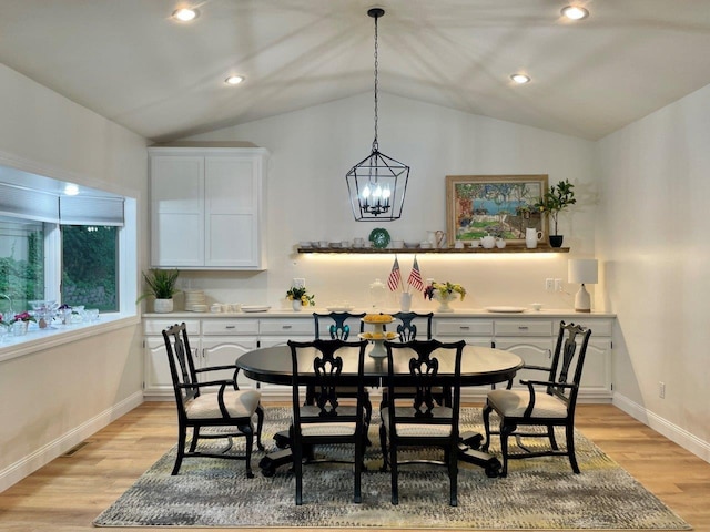 dining room with light wood finished floors, baseboards, vaulted ceiling, and recessed lighting