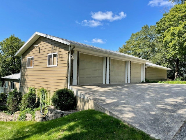 view of side of property featuring a garage