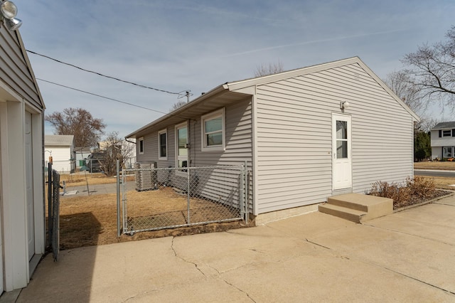 view of property exterior featuring a patio area and fence