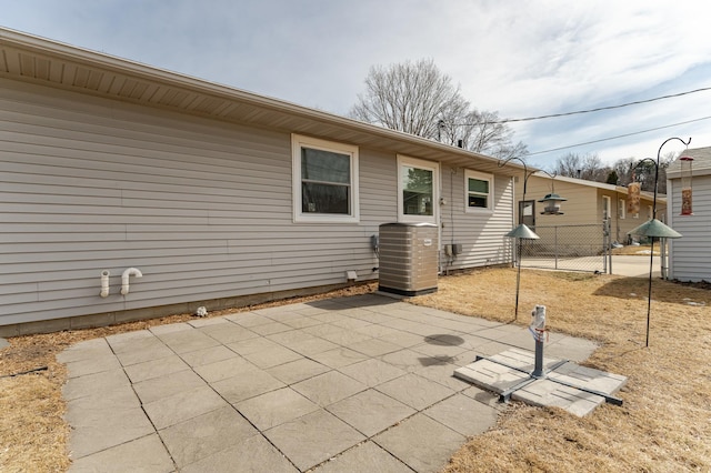 view of patio / terrace featuring cooling unit and fence