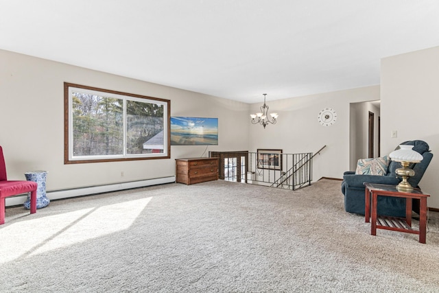 sitting room with a chandelier, an upstairs landing, baseboard heating, and carpet floors