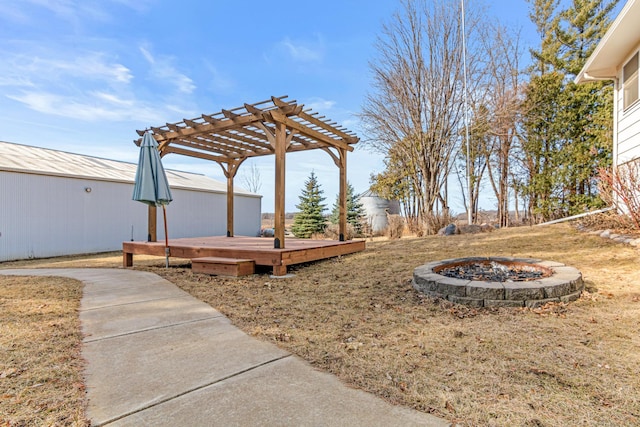 view of yard with a wooden deck and a pergola