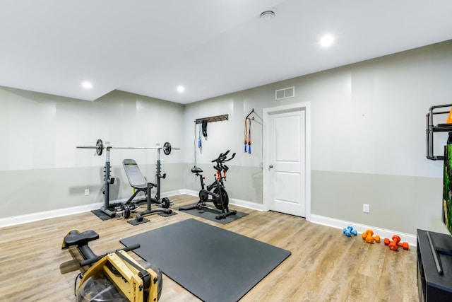 exercise room with recessed lighting, wood finished floors, visible vents, and baseboards