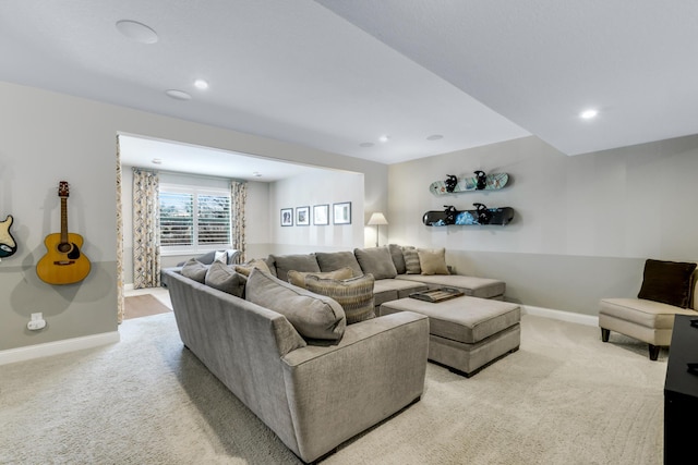 living room with recessed lighting, light carpet, and baseboards