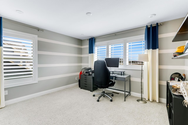 carpeted office space with baseboards