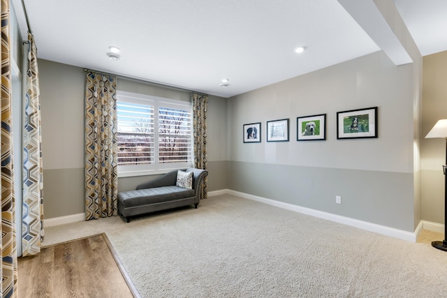 sitting room with carpet and baseboards