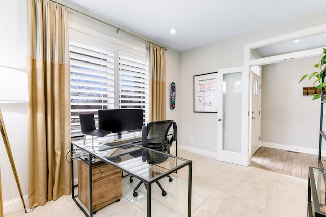 carpeted office space with french doors, recessed lighting, and baseboards