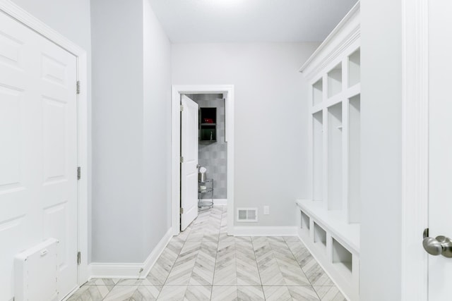 mudroom featuring visible vents and baseboards