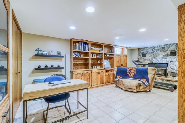 office space with recessed lighting and a fireplace