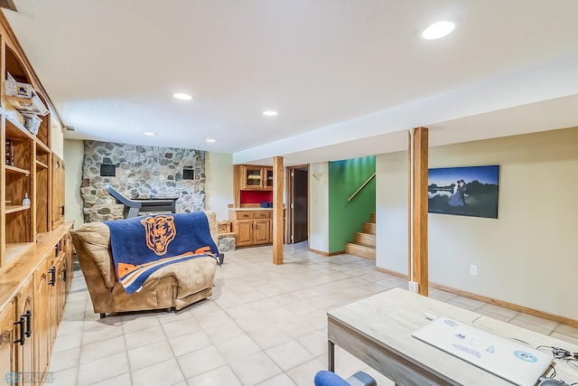 living area featuring stairs, light tile patterned floors, baseboards, and recessed lighting