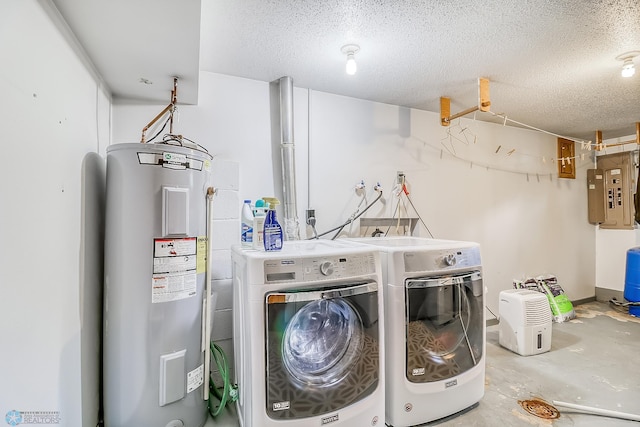 washroom featuring laundry area, water heater, a textured ceiling, and independent washer and dryer